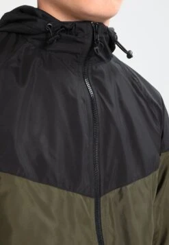 URBAN CLASSICS Tone Tech - Windjack - Black/Dark Olive -Urban Classics 556e425a1bda48ae8d13751f01ac52ec