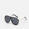 URBAN CLASSICS Naxos With Chain Unisex - Zonnebril - Black/Gold-Coloured